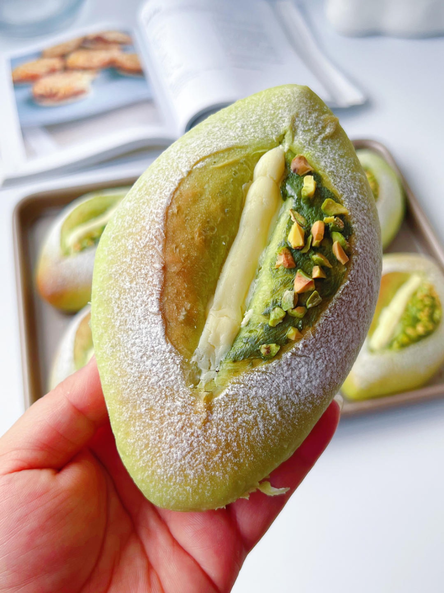 Close up of the green pistachio crumb and cream cheese filling