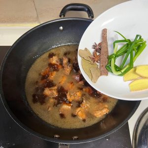 Add the aromatics, scallion, and ginger slice