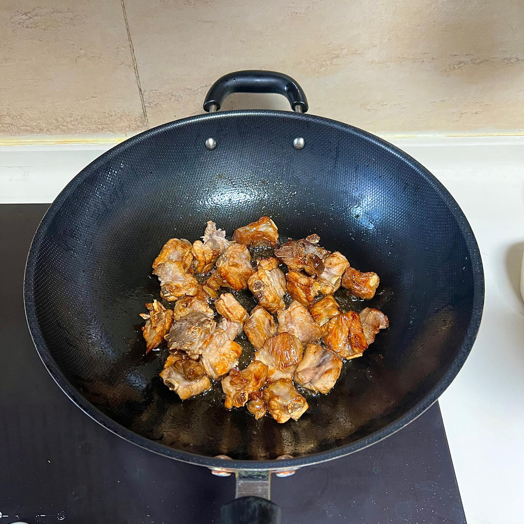 Add the ribs and stir-fry until golden on bot