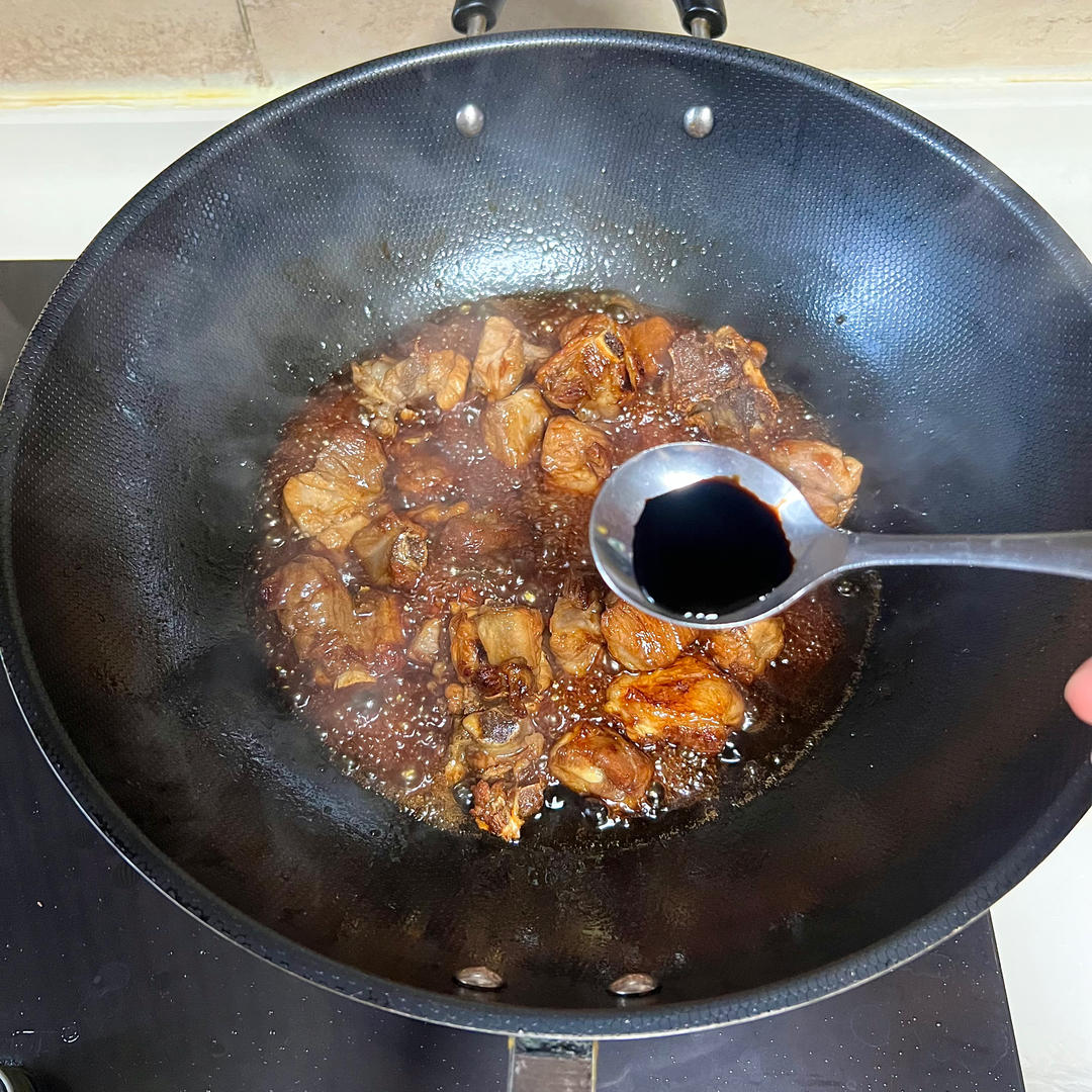 Add a small half spoon of dark soy sauce