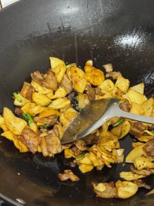 Sugar and MSG being added to the stir-fry