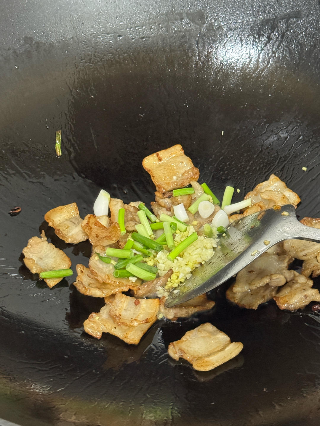 Scallion added to the wok