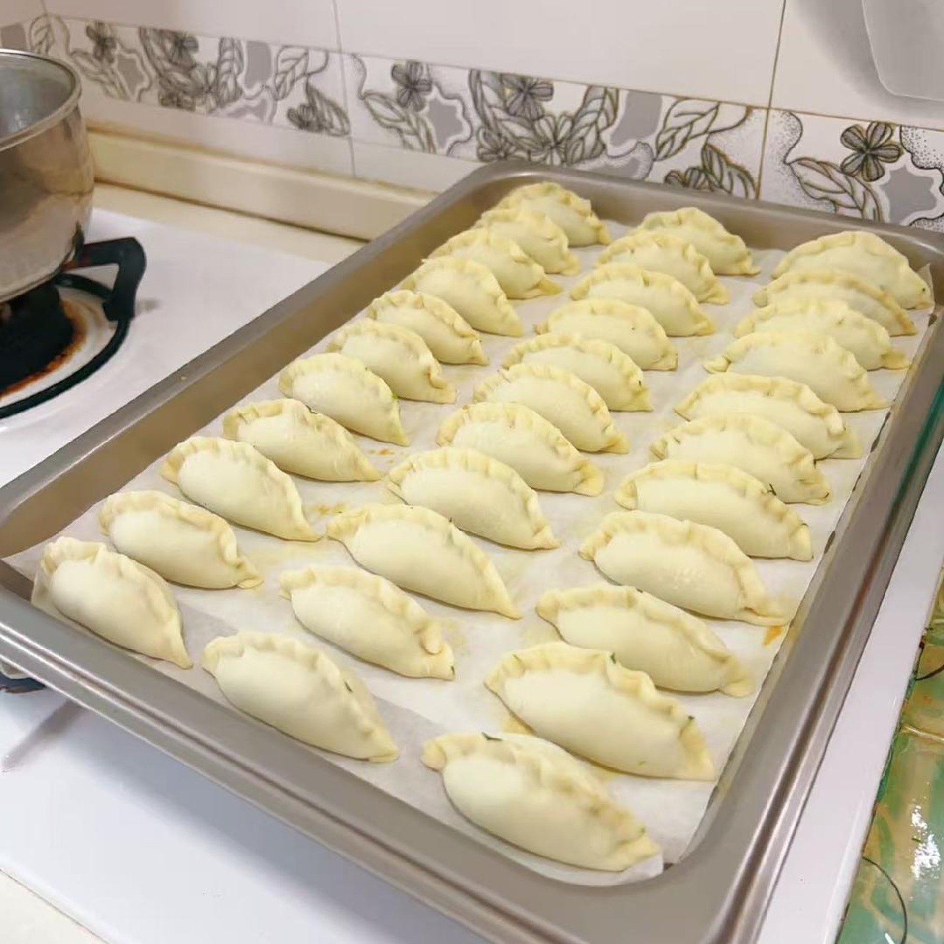 Fold a flat, pleated row for potstickers, steamed dumplings, or pan-fried dumplings, or leave both ends open and pinch only the middle for potstickers.