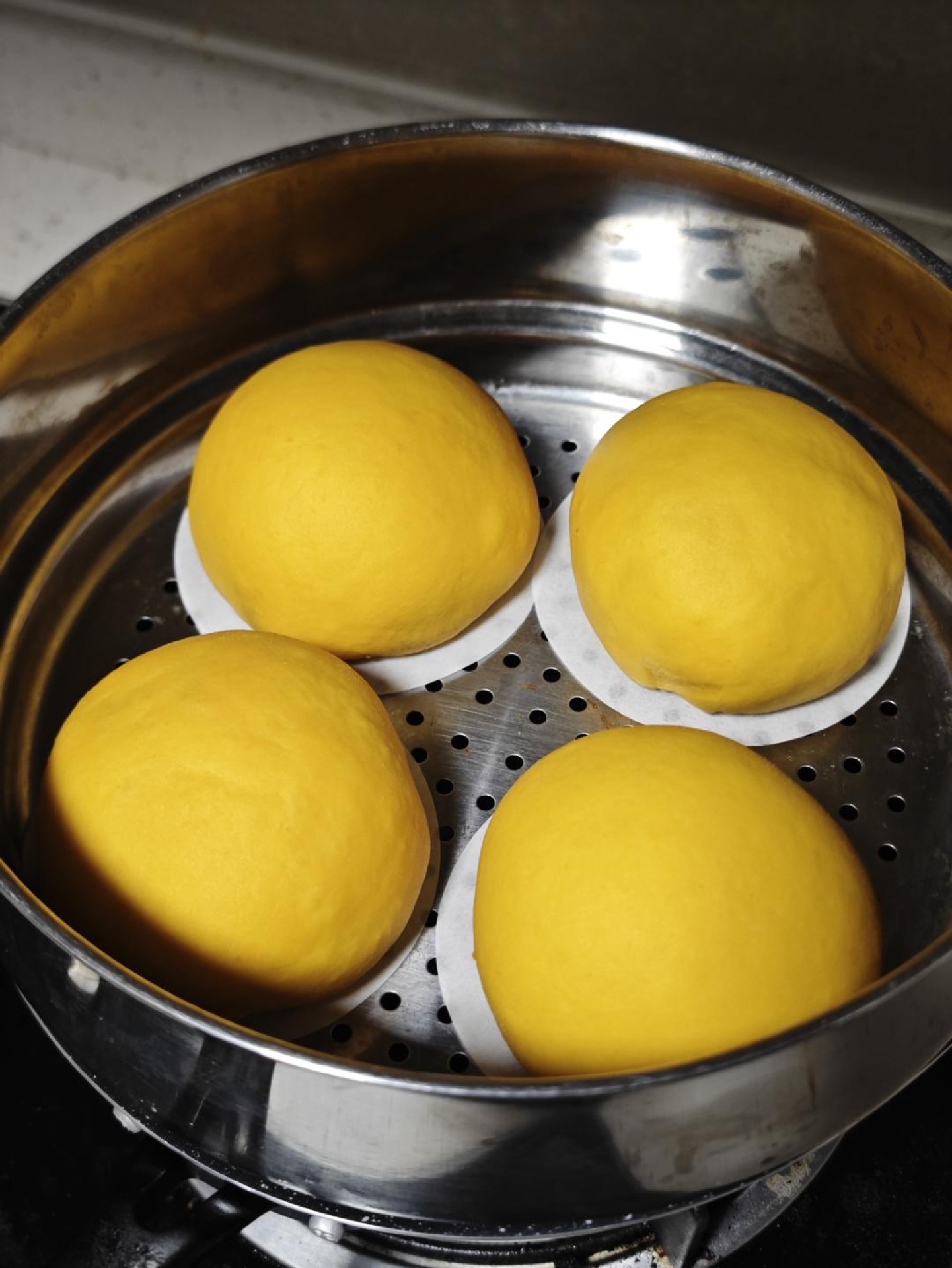 Put them somewhere warm to proof until doubled in size, and remember to cover with a lid. This formula suits beginners and needs only a single proof; adjust the proofing time accor