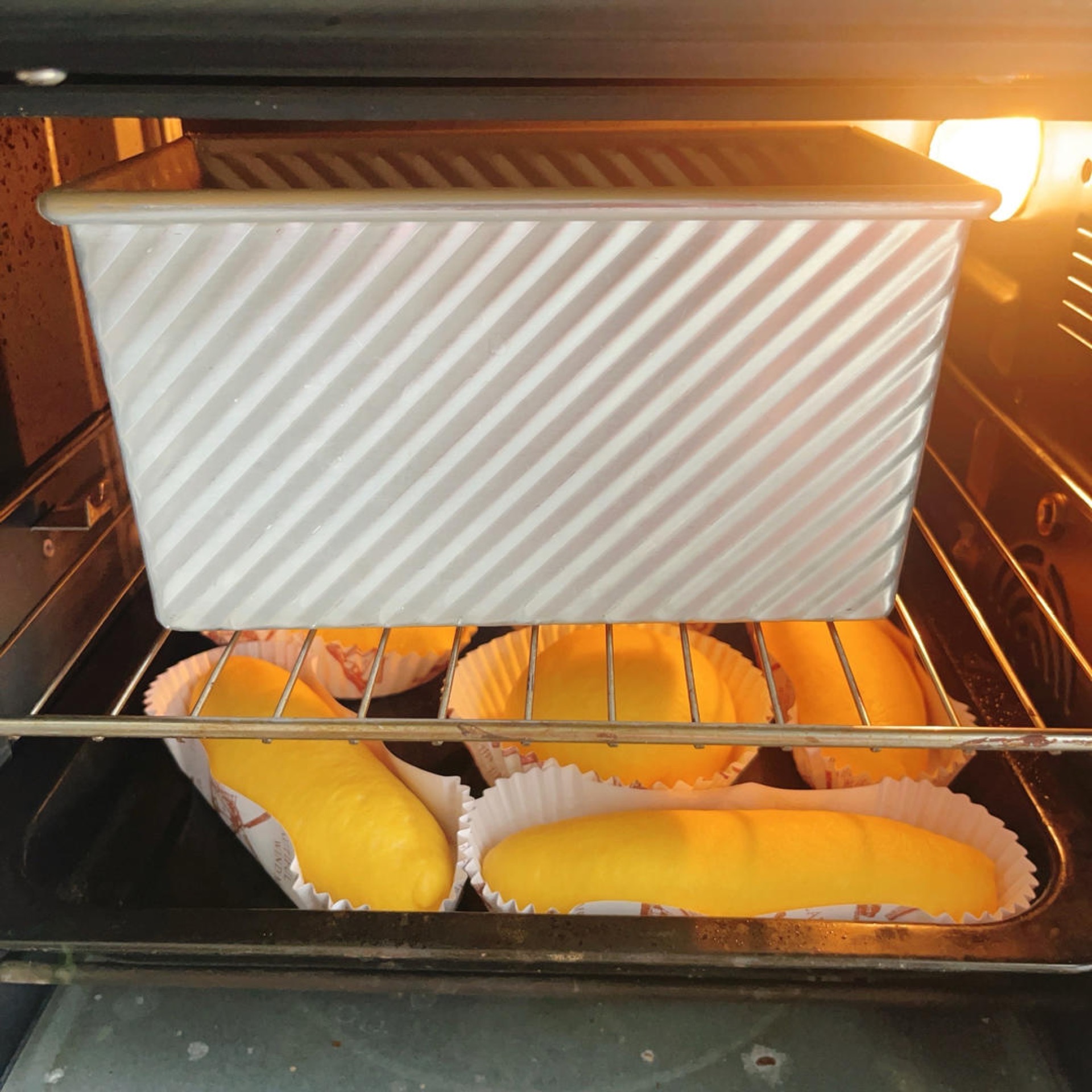 Proofed pumpkin loaf risen to 80 percent of the pan