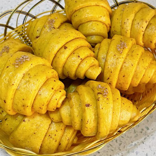 Soft steamed pumpkin and red date buns dotted with sesame seeds