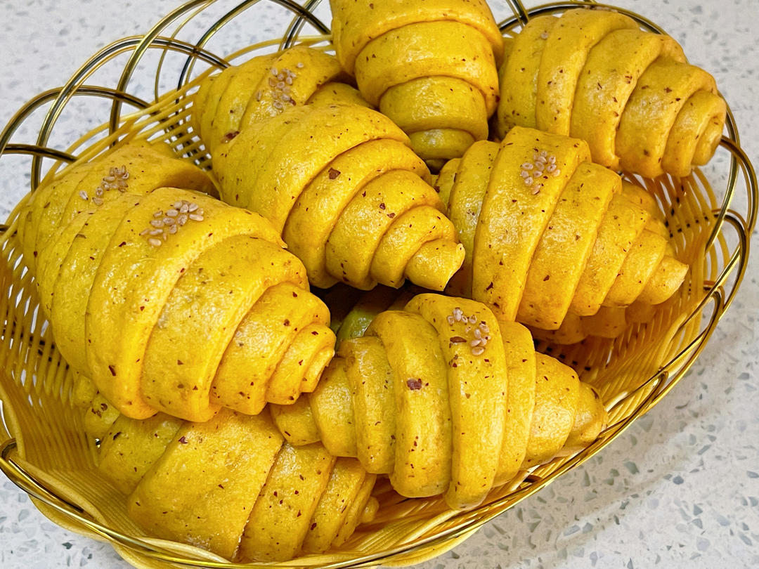 Soft steamed pumpkin and red date buns dotted with sesame seeds