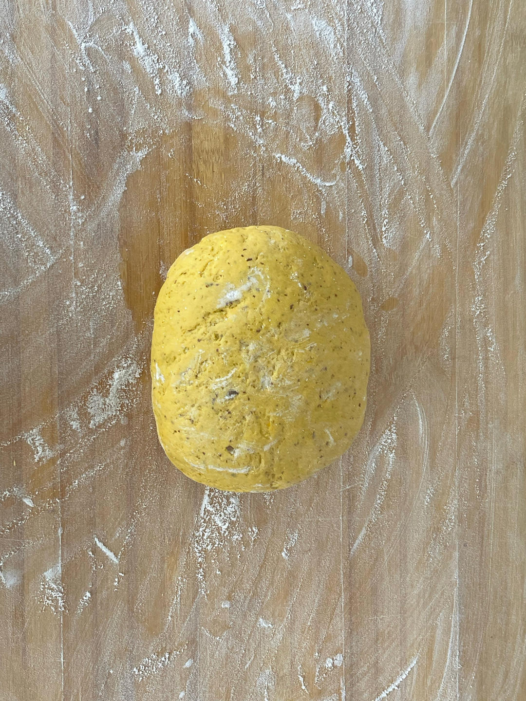 Kneading the rested dough to release air