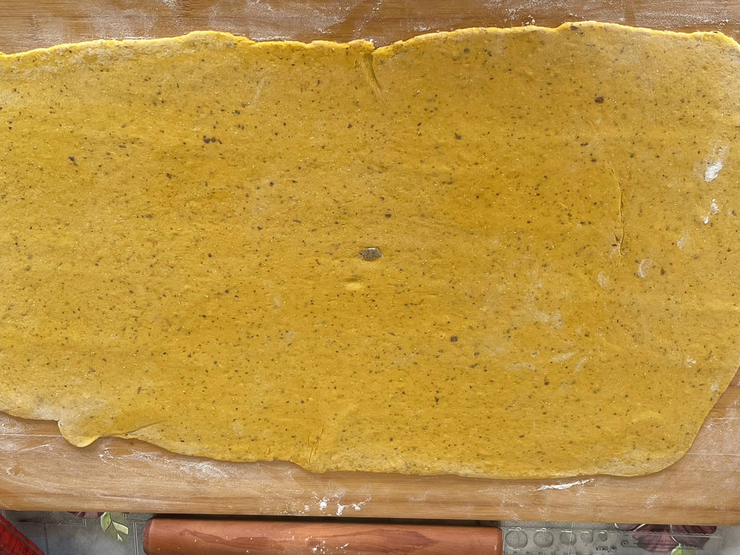 Rolling the dough into a large thin sheet