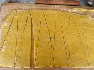 Cutting the dough sheet into fifteen triangles