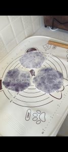 Pancakes rolled thin with the purple filling inside