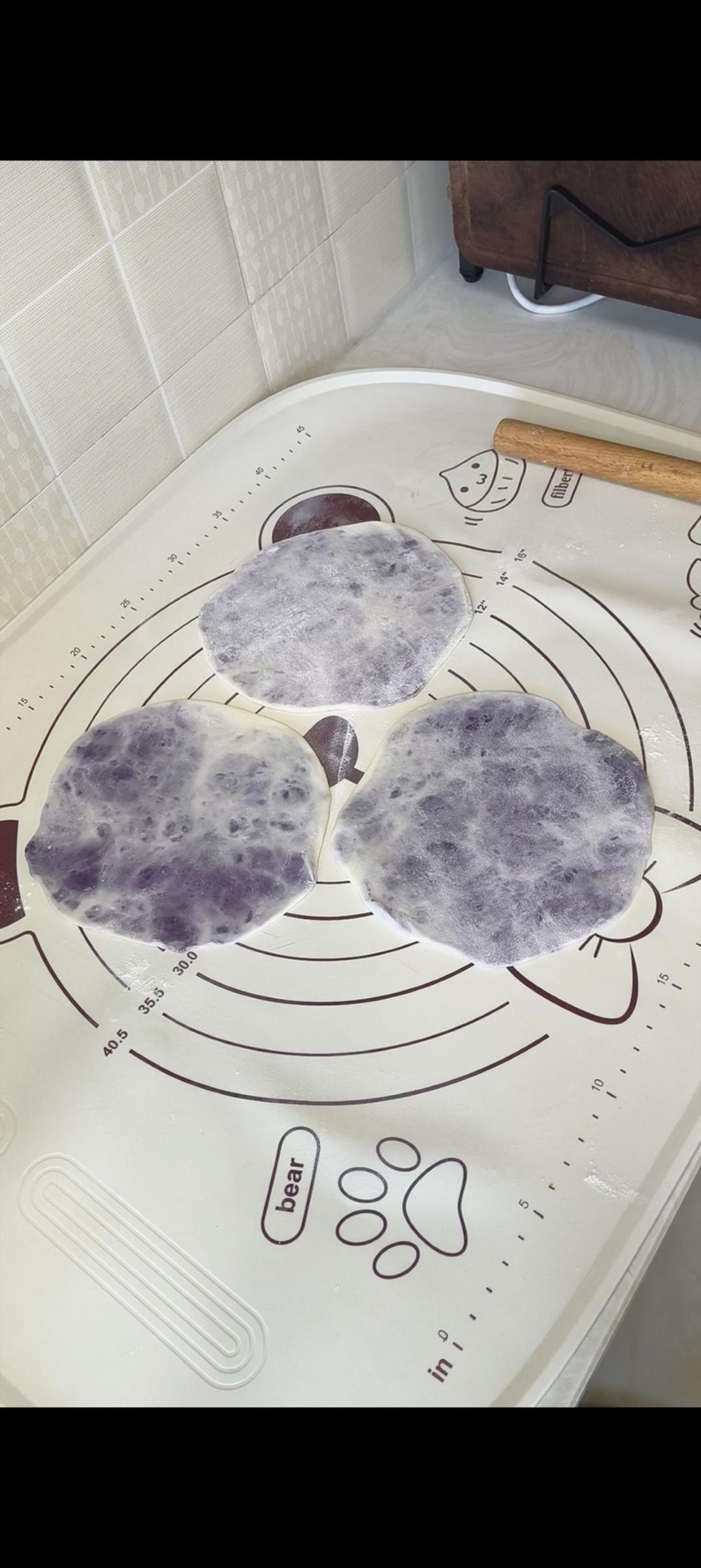 Pancakes rolled thin with the purple filling inside