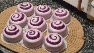 Finished purple sweet potato steamed rolls on a plate