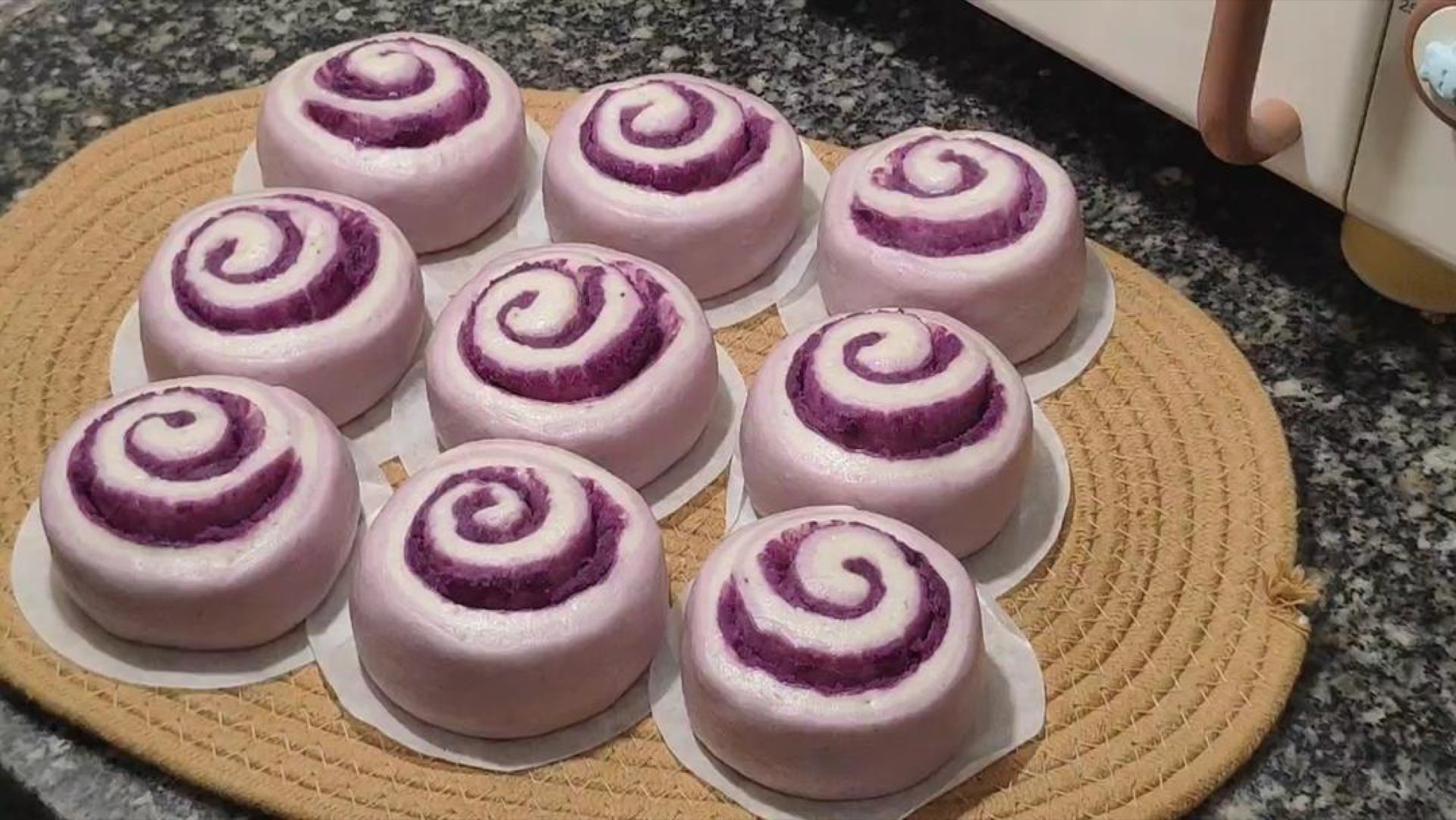 Finished purple sweet potato steamed rolls on a plate