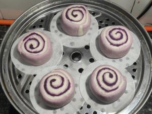 Proofed rolls in the steamer basket