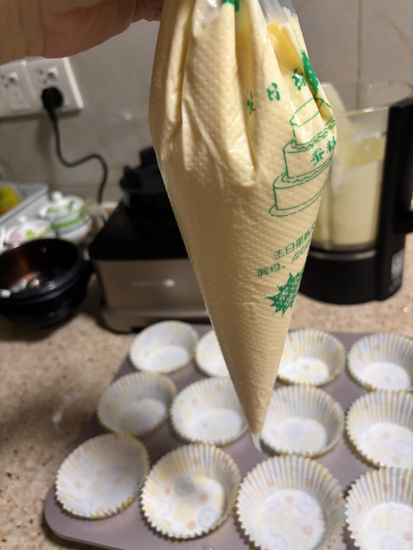 Batter poured into a piping bag for filling cups
