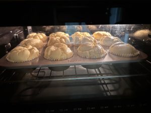 Durian Basque cheesecake cups baking in the oven