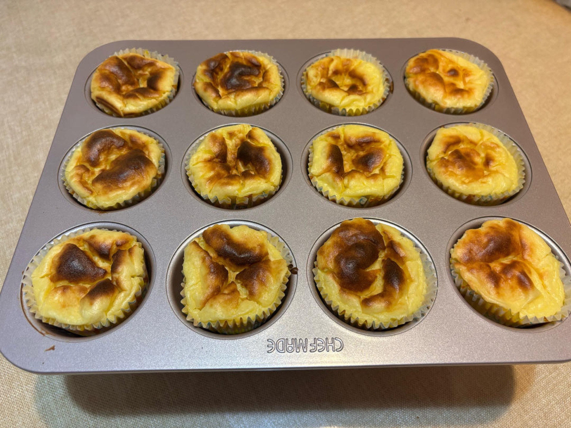 Cooled durian Basque cheesecake cups after deflating