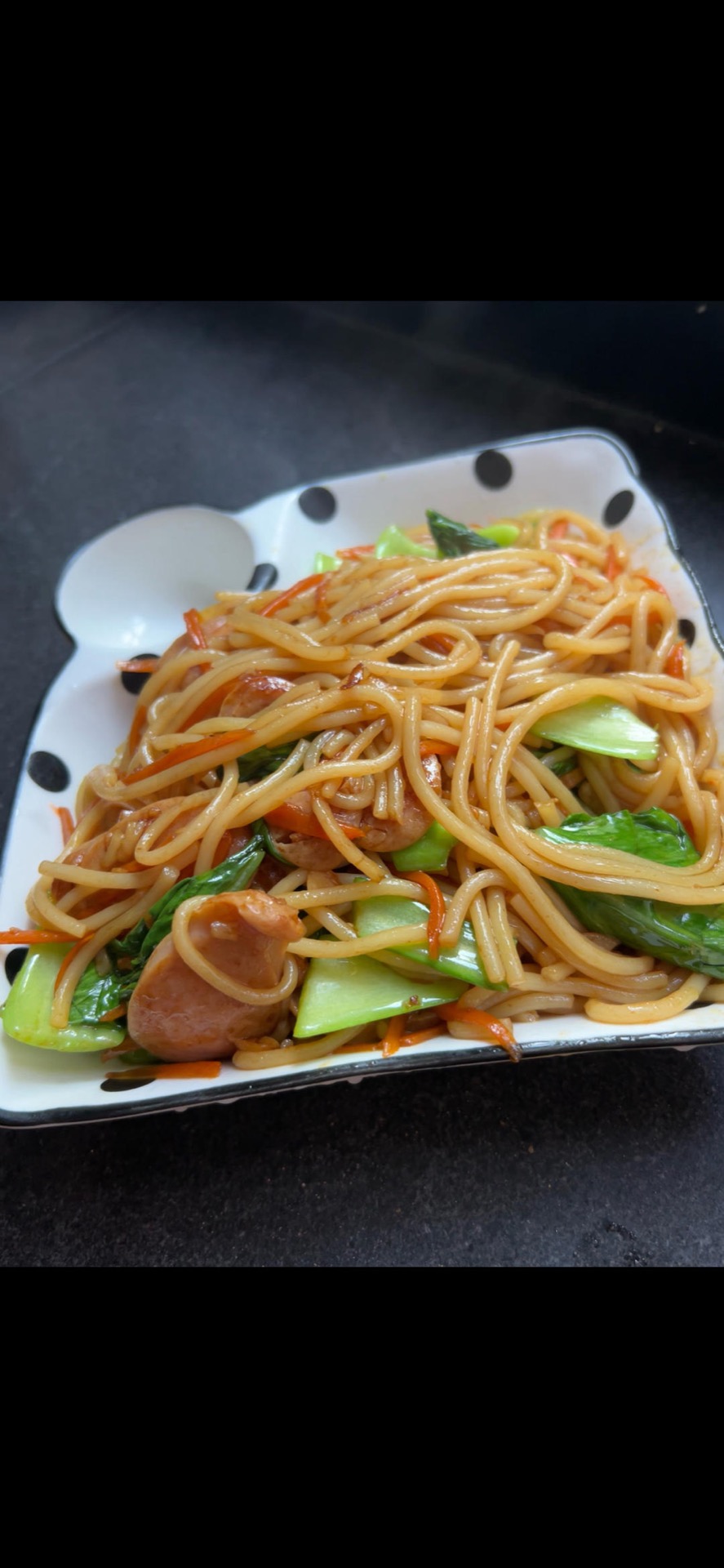 A plate of quick stir-fried fresh rice noodles ready to eat