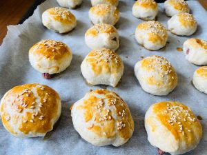 Red bean puff pastry parcels baking until golden in the oven