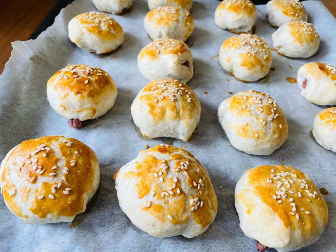 Red bean puff pastry parcels baking until golden in the oven