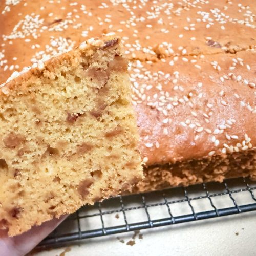 Sliced red date cake with a soft amber crumb