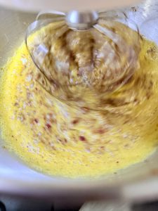 Whipping the eggs and date paste to ribbon stage