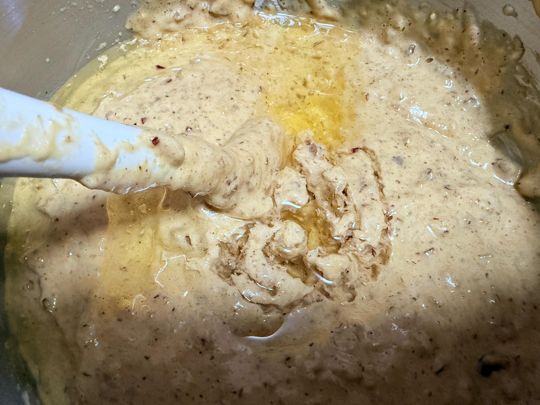 Folding corn oil into the cake batter