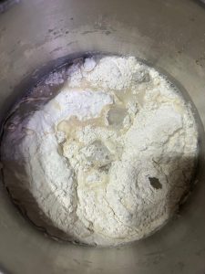 Smooth white mantou dough kneaded in a bowl