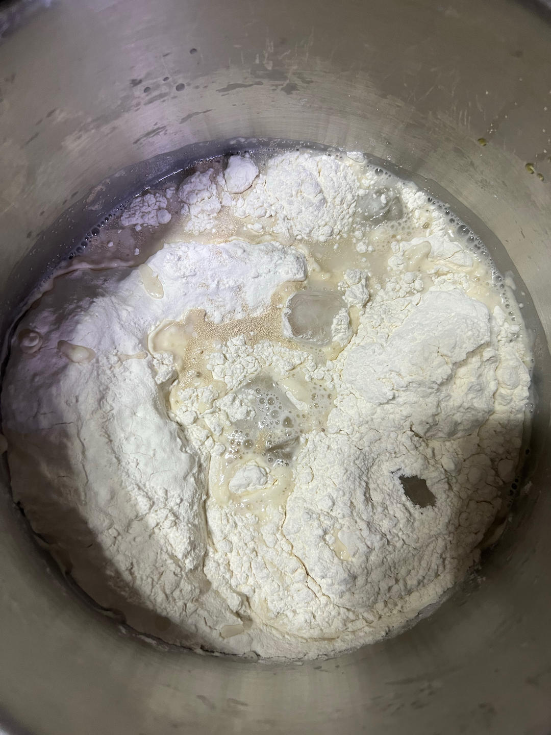 Smooth white mantou dough kneaded in a bowl