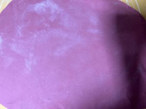 Red dough rolled into a thin even sheet