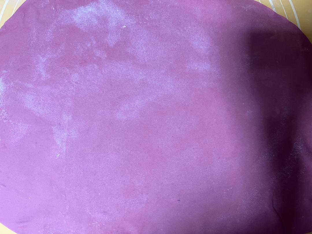 Red dough rolled into a thin even sheet