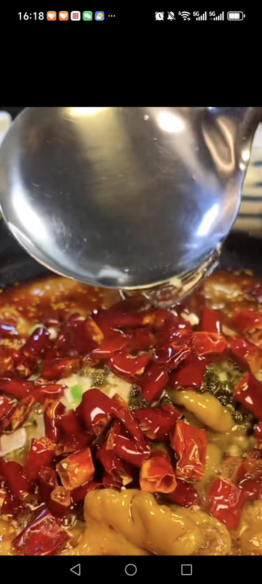 Heat oil until it is smoking and pour it over the chilies and peppercorns to release their aroma.