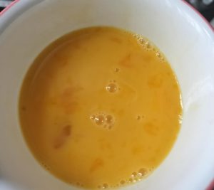 Beat the eggs until the whites and yolks are fully combined and slightly frothy.