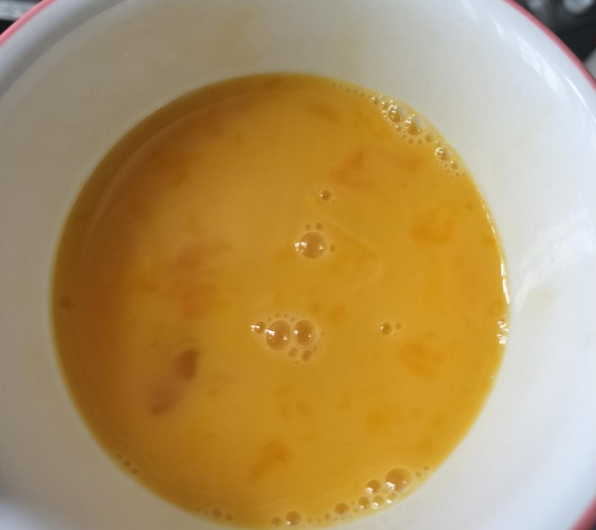 Beat the eggs until the whites and yolks are fully combined and slightly frothy.