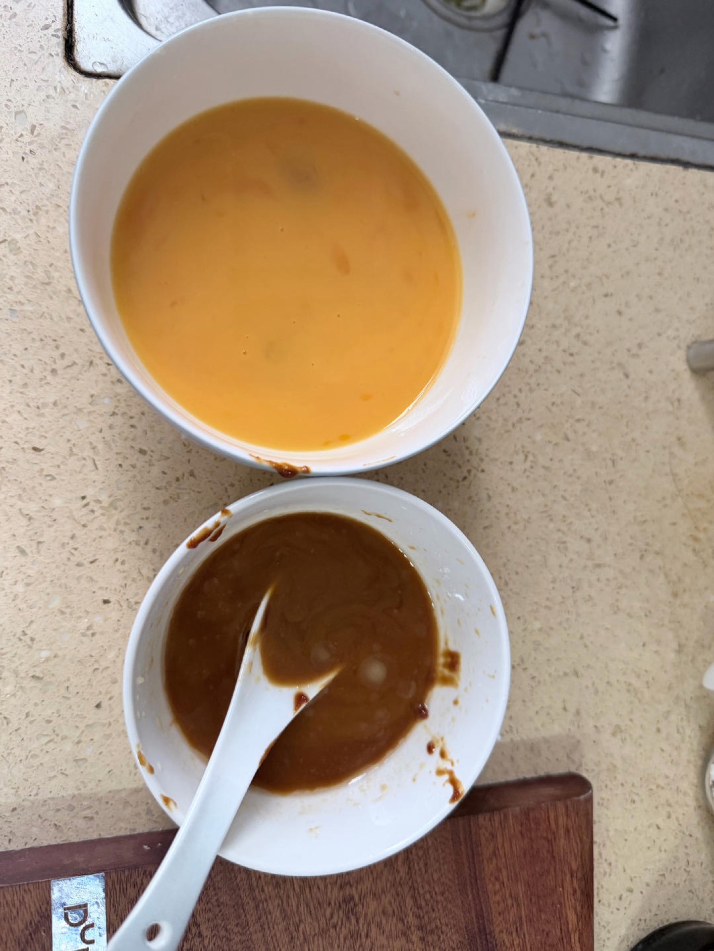 Beat the eggs until uniform and frothy, then whisk together the soybean paste, sweet flour paste, soy sauce, oyster sauce, sesame oil, cornstarch, and water in a small bowl until s