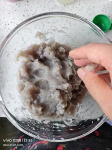 Mackerel paste after peppercorn water has been beaten in, glossy and pale
