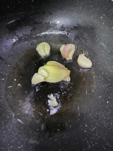 Fry ginger garlic Sichuan peppercorns and star anise then add the pork cartilage