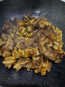 Add light dark and oyster sauce then the green chilies and bird's eye chilies and toss