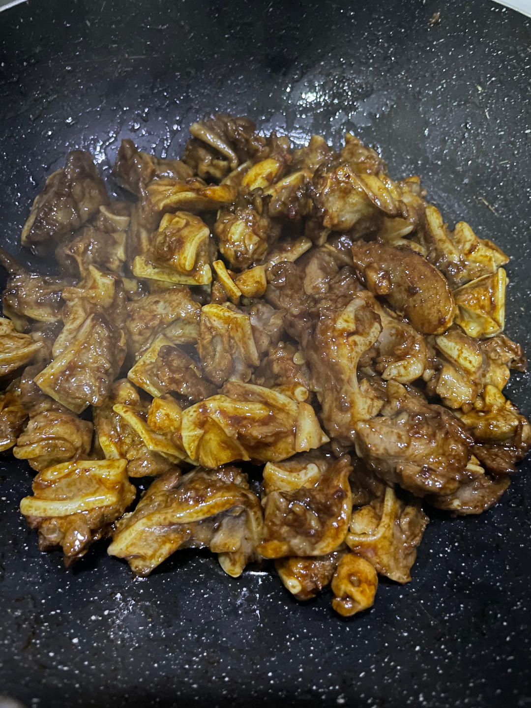 Add light dark and oyster sauce then the green chilies and bird's eye chilies and toss