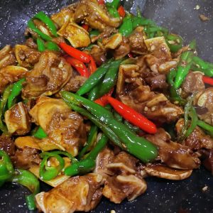 Plated spicy pork cartilage ready to serve over rice