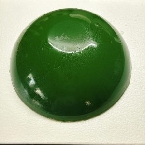It flops out with a soft thud, a big translucent green block that wobbles like jelly and begs to be bitten.