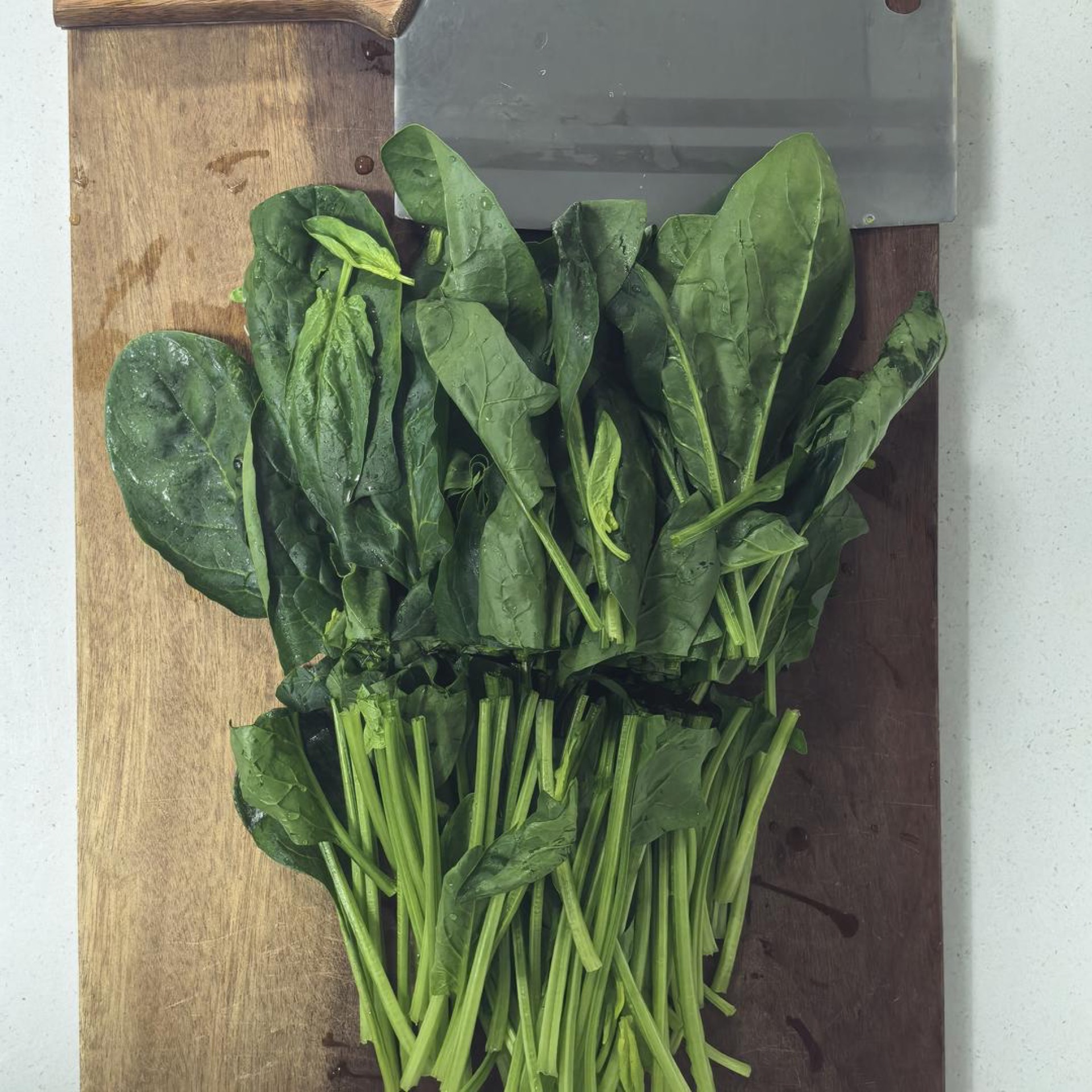 Wash the spinach well and cut it into lengths — large spinach leaves should be cut into three segments.