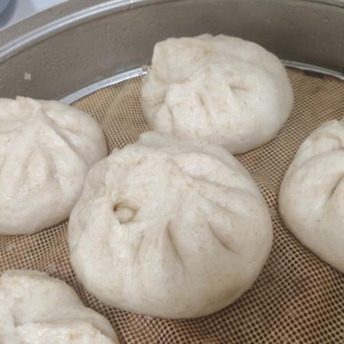 Fluffy steamed buns dough proofed and ready for the steamer