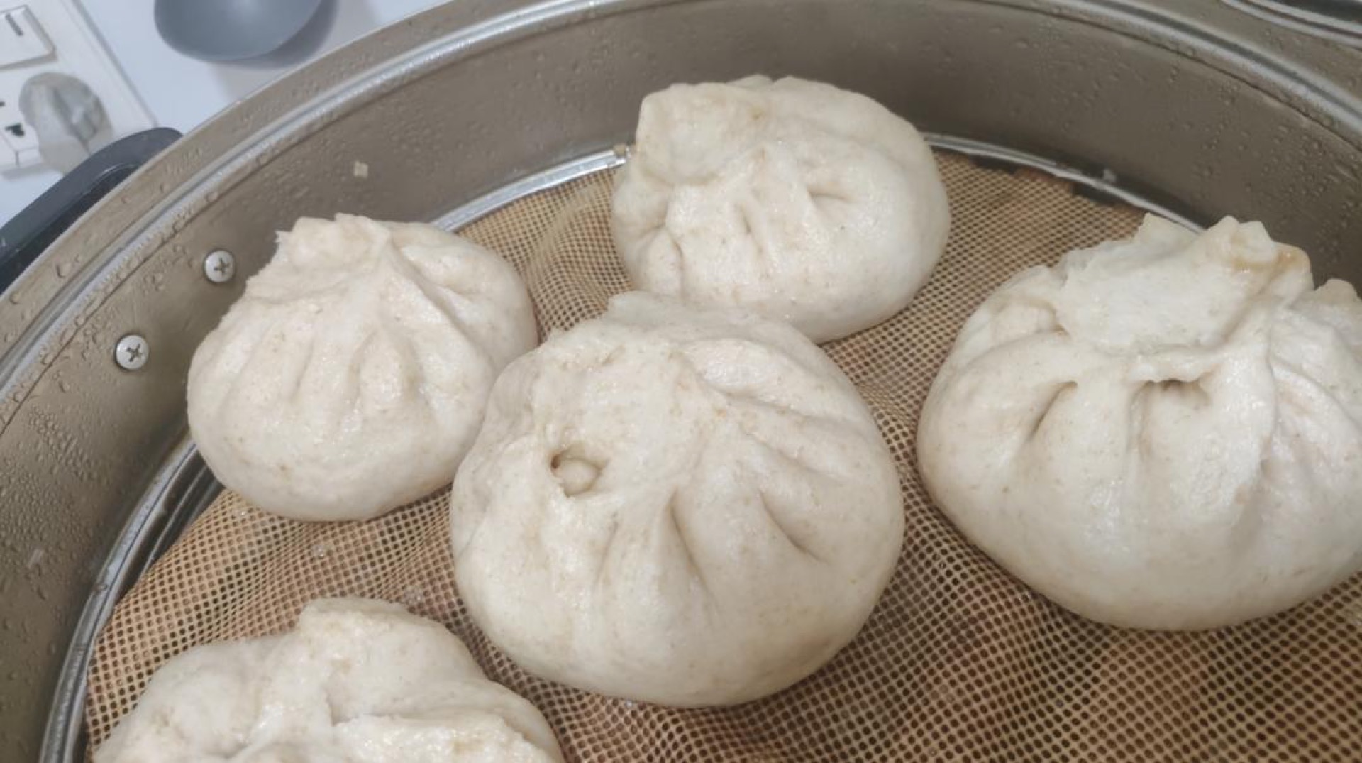Fluffy steamed buns dough proofed and ready for the steamer