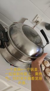 Single steamer tier held over boiling pot to catch steam