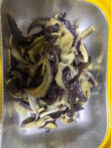 Let the eggplant cool, then tear it into strips with your hands and set aside (you can leave the eggplant out entirely if you do not care for it).