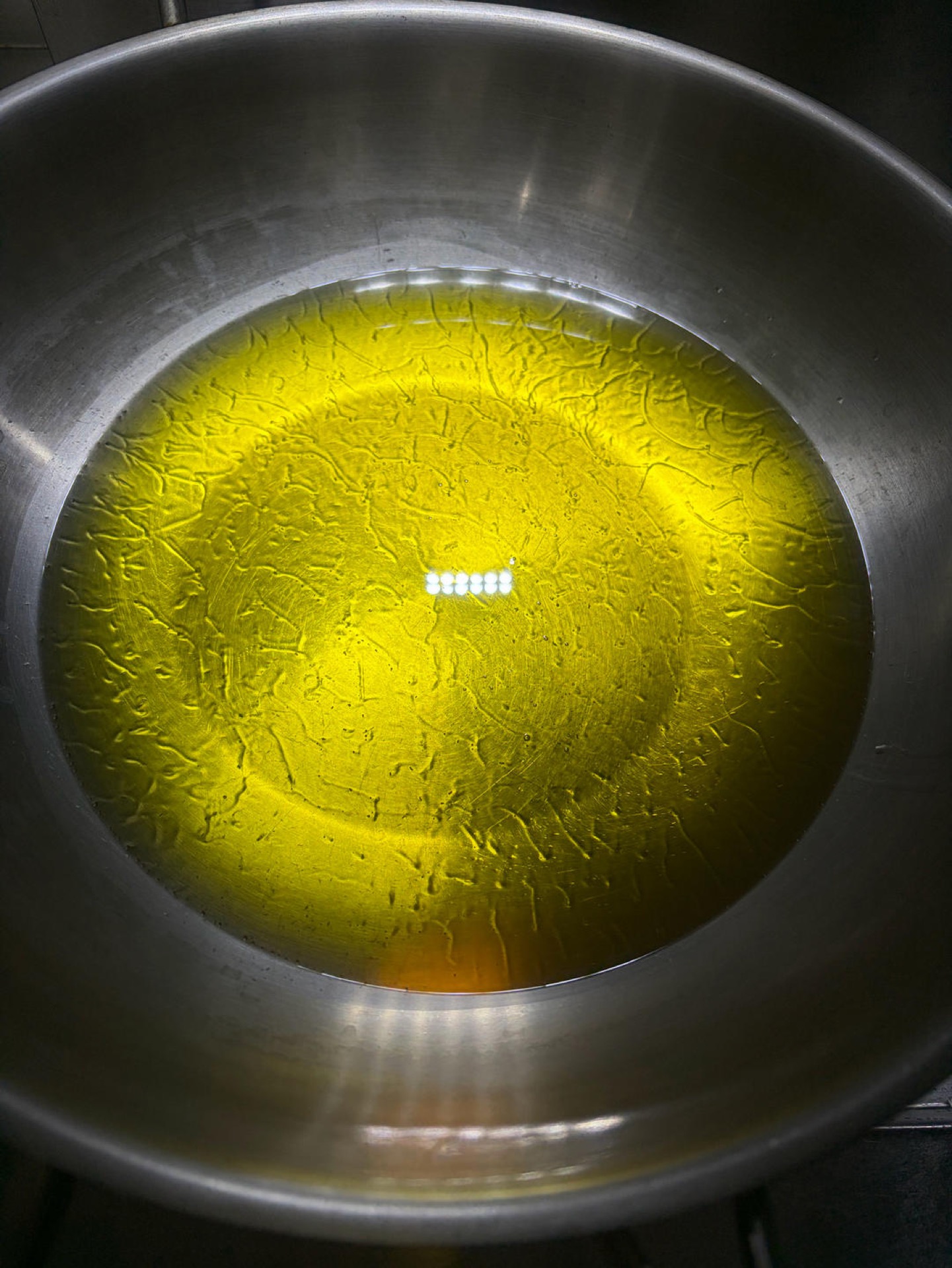 Add oil to the wok — use plenty, because too little oil makes the sauce spoil faster.