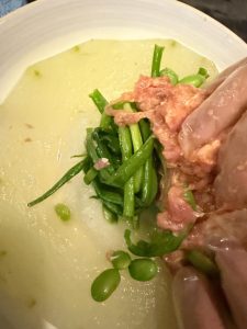 Lay a small handful of scallions in the hollow of the winter melon, then press the pork filling in firmly on top.