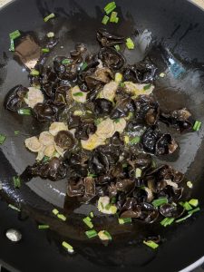 Add the sliced meat and stir-fry for another dozen or so tosses.